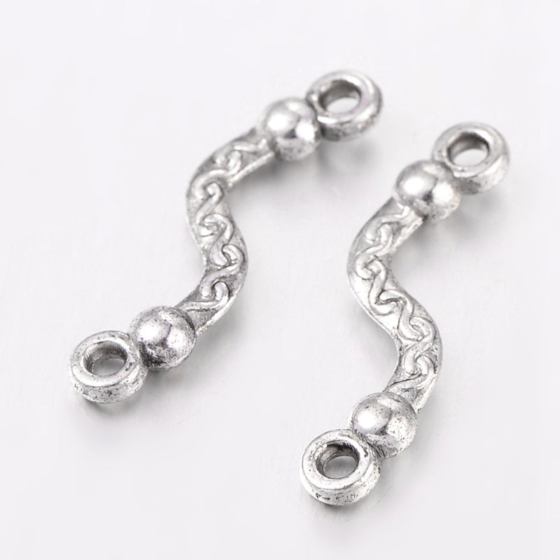 Vedhæng, link, twistet, FS, ca. 22.5x6x3mm. 10 stk.