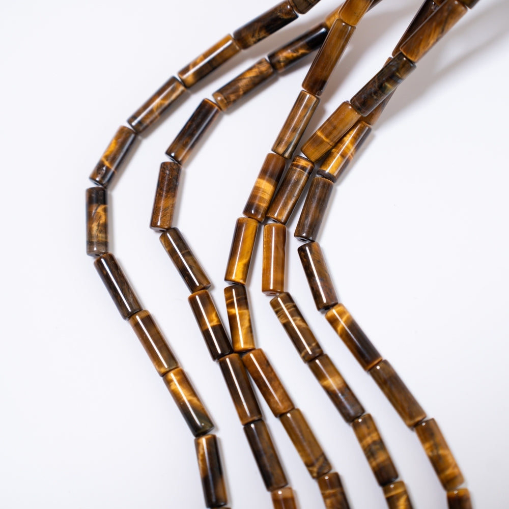 Tigerøje, 4.5x13.5mm cylinder formet, hel streng 38cm