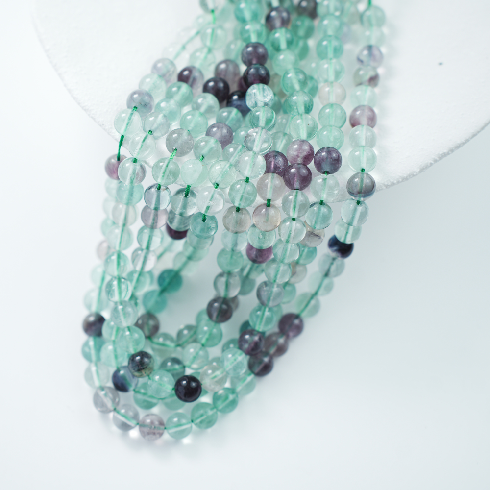 Fluorescerende Kvarts,8mm rund,hel streng 37cm