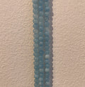 Aquamarin, rund, ca. 4-5 mm, 1 streng