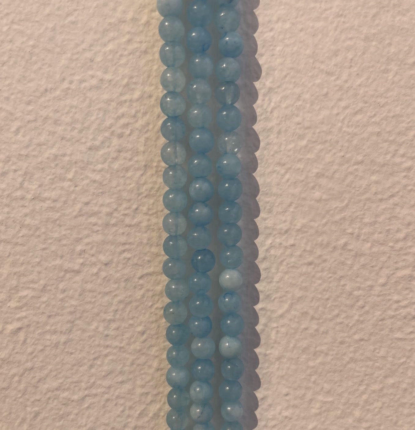 Aquamarin, rund, ca. 4-5 mm, 1 streng