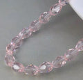 Bjergkrystal , facetteret oval 7.5 × 12 mm , hel streng