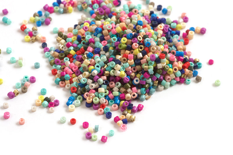 Seed beads, ca. 1,5-2x1-2 mm, multicolour, ca. 10 gram