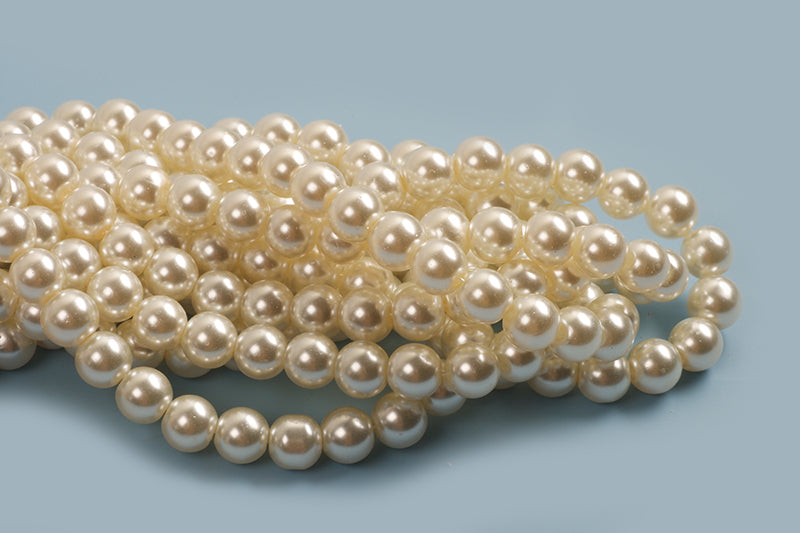 Glasperle, perlemor, ca. 8-9 mm, cremefarvet, ca. 105 perler