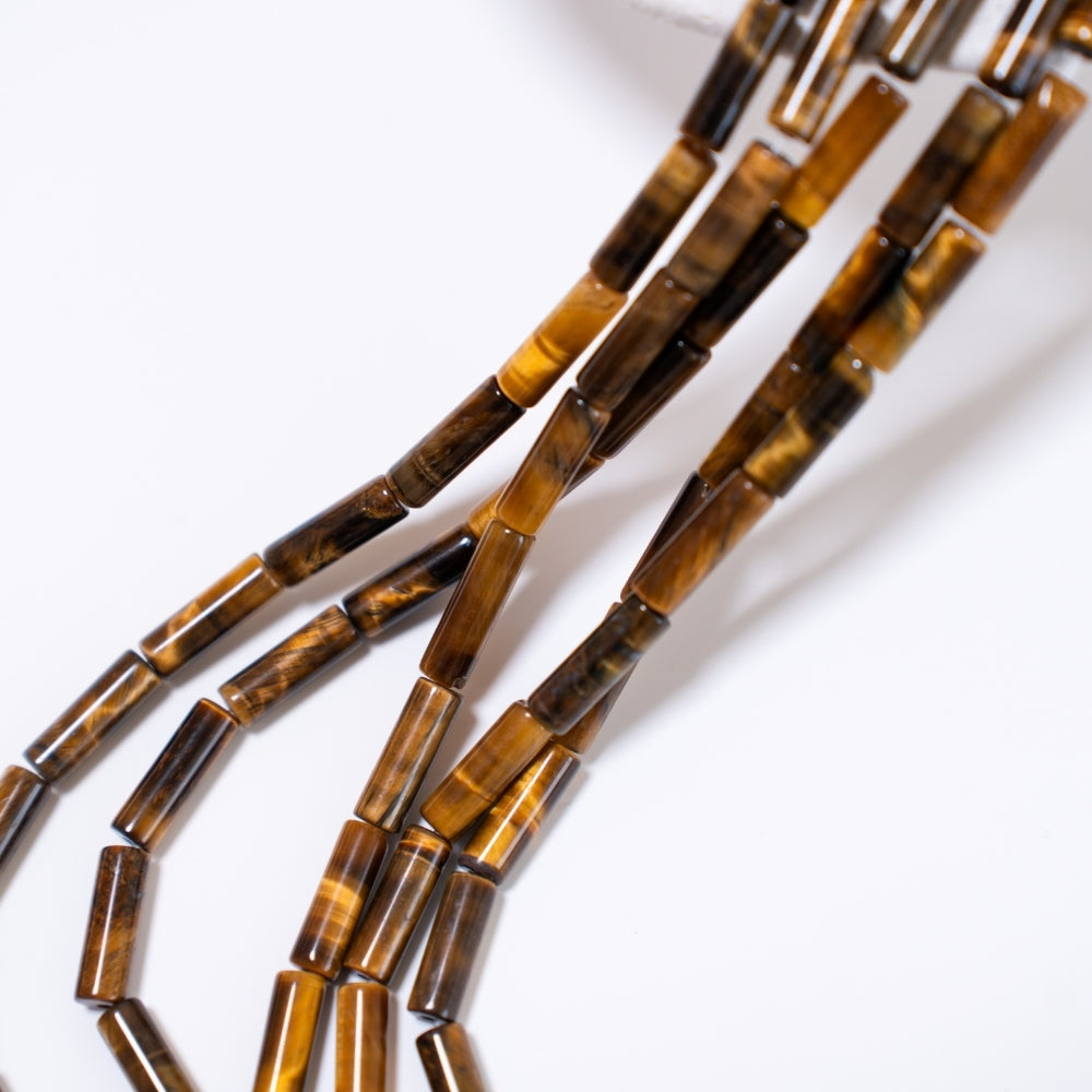 Tigerøje, 4.5x13.5mm cylinder formet, hel streng 38cm