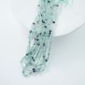 Fluorescerende Kvarts，4mm rund，hel streng 37cm