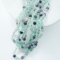 Fluorescerende Kvarts，6mm rund，hel streng 37cm