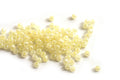 Seed beads, ca. 3 mm, lys gul med shine, ca. 15 gram