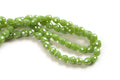 Glasperle, dråbe, facet, grøn, 4,5x4,5 mm, 1 streng