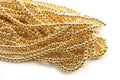Hæmatit, rund, guldfarvet, 4 mm, 1 streng
