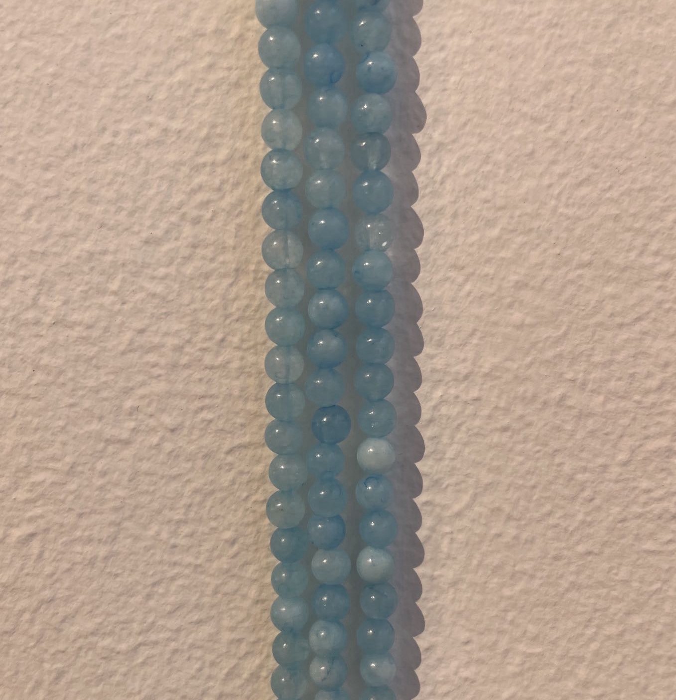 Aquamarin, rund, ca. 4-5 mm, 1 streng