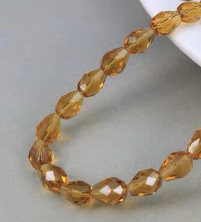 Citrin, facetteret oval 7.5 mm , hel streng