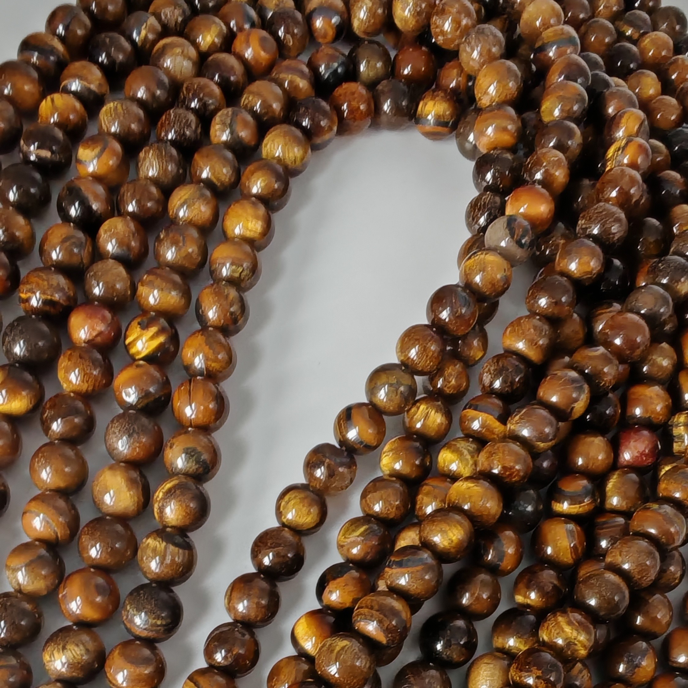 Tigerøje, rund, 10 mm, 1 streng