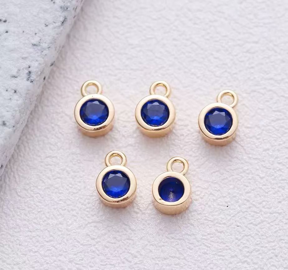 Vedhæng,Rund m/ blå zirkoniasten,5.2 x7 mm. FG, 5 stk.