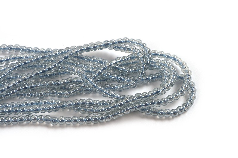 Glasperle, ca. 2,5 mm, lyseblå, 1 streng