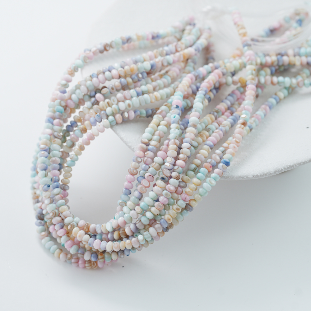Naturlige Macaroner skal perler,5mm rondeller, hel streng 38cm.