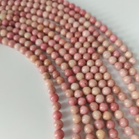 Rhodonite , rund 6 mm , hel streng
